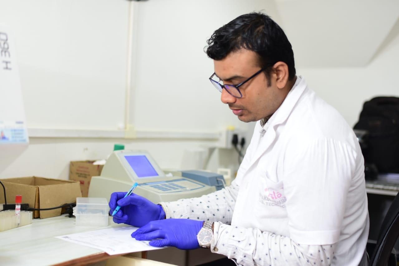 Pathologist reviewing a report — UHS Vista, Guwahati